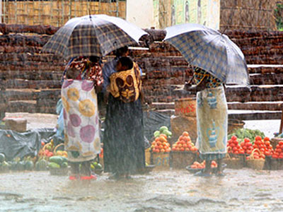 People buying food in a monsoon's rain.