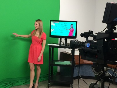 Using the greenscreen for the nightly broadcast. 